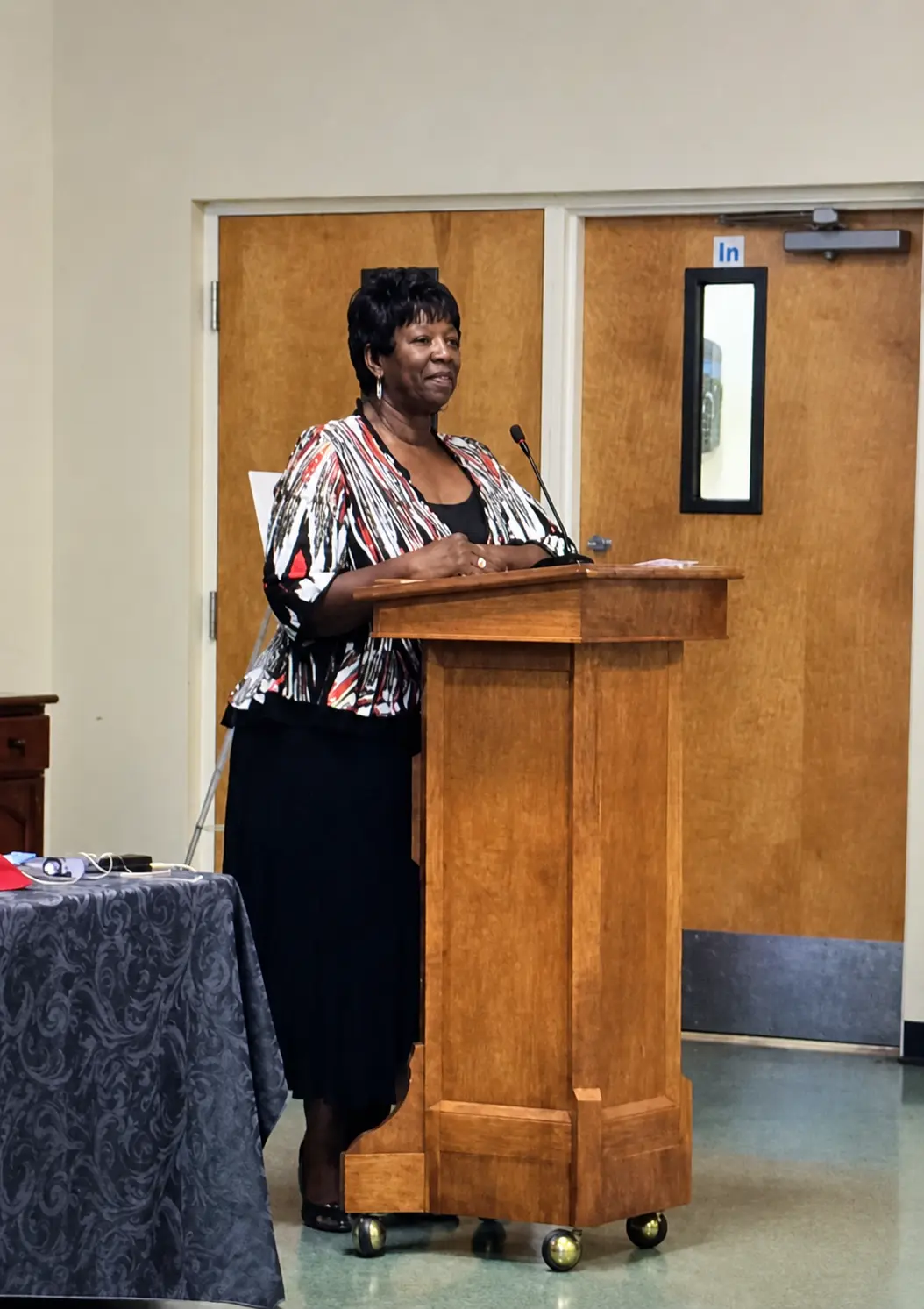 Mae Dixon speaking at a community event