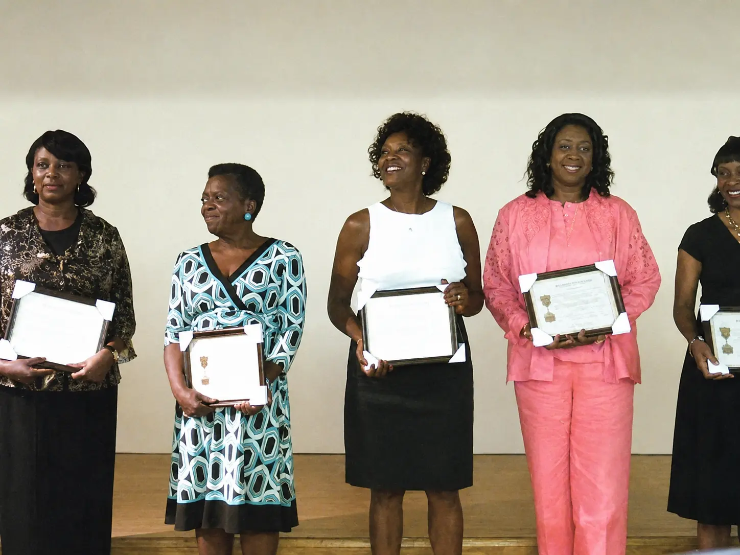 Women receiving certificates of recognition