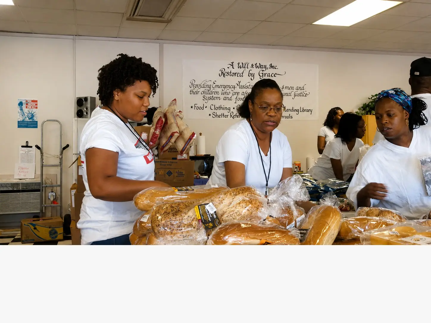 Volunteers preparing bread for distribution