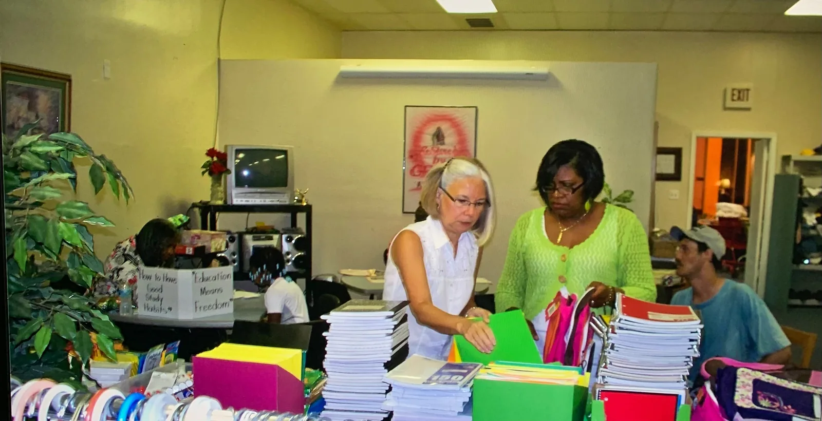 Volunteers preparing school supplies for local students