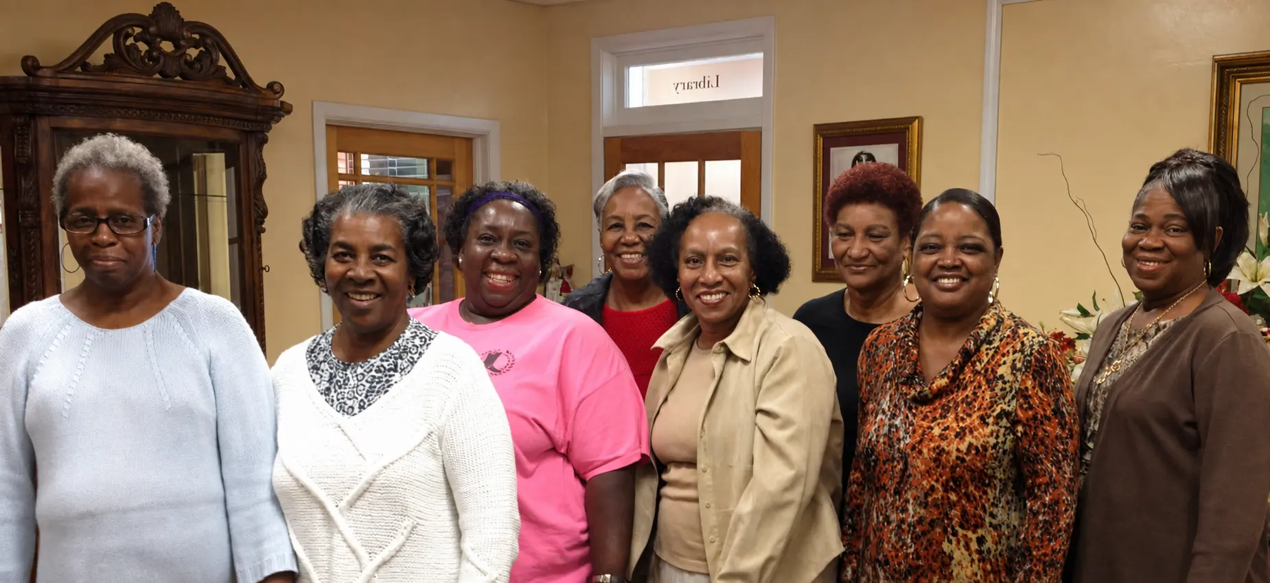Women gathered in a supportive community circle