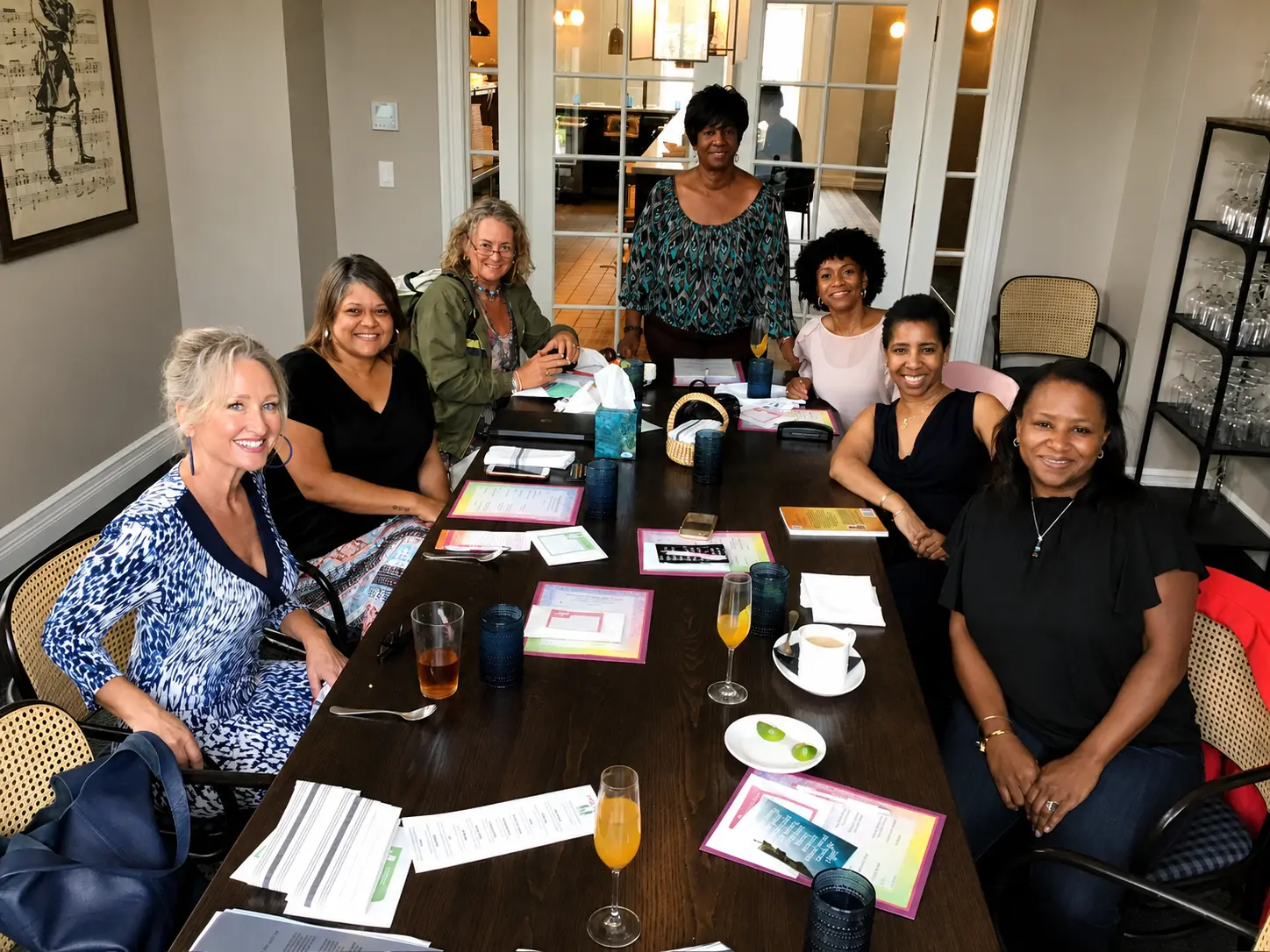 Women planning and learning together around a workshop table